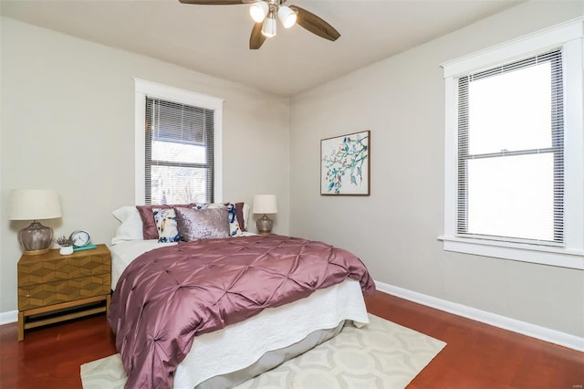 bedroom featuring ceiling fan and dark hardwood / wood-style floors