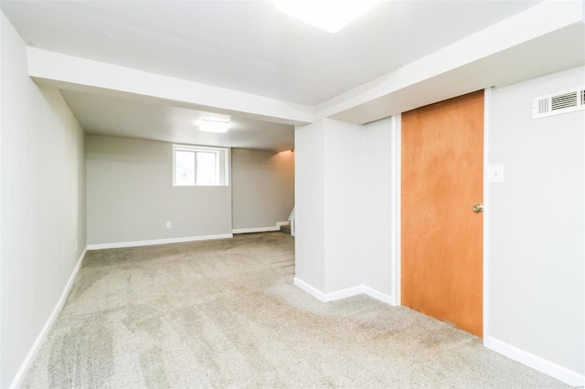 basement with light colored carpet