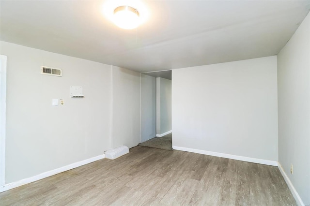 unfurnished room with light hardwood / wood-style flooring