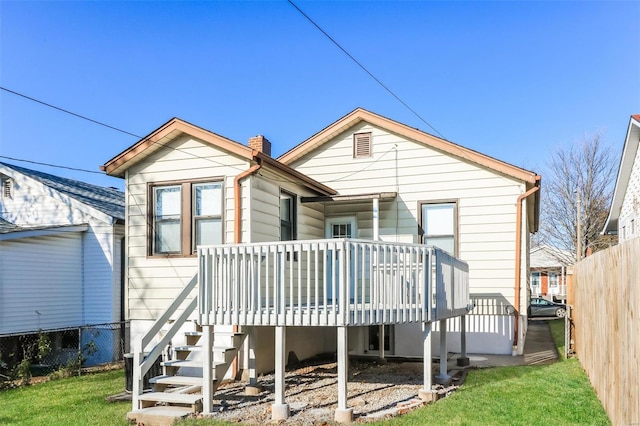 back of house featuring a deck