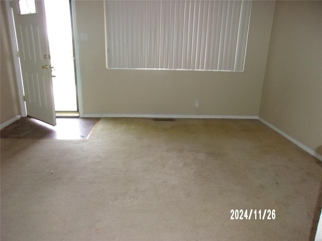 view of carpeted foyer