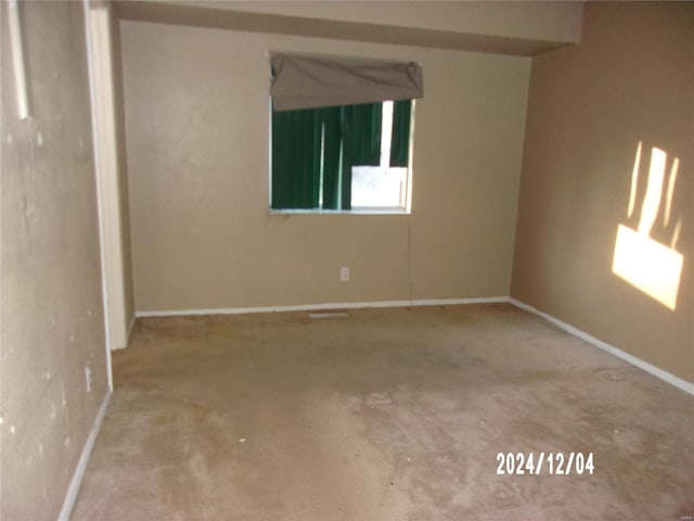 empty room featuring carpet flooring