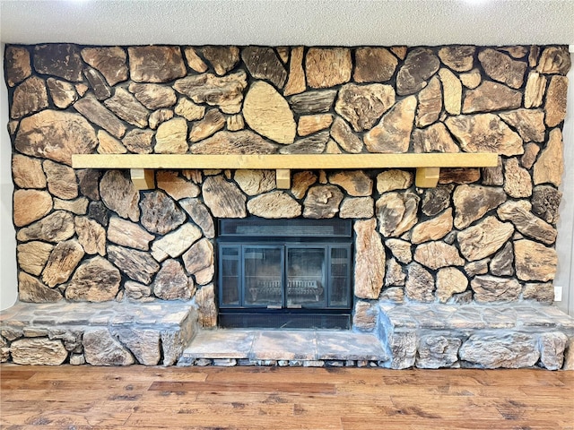 details featuring a fireplace and a textured ceiling