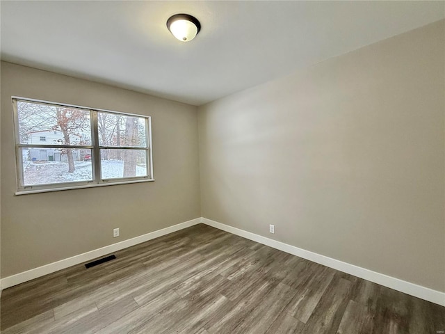 empty room featuring hardwood / wood-style floors