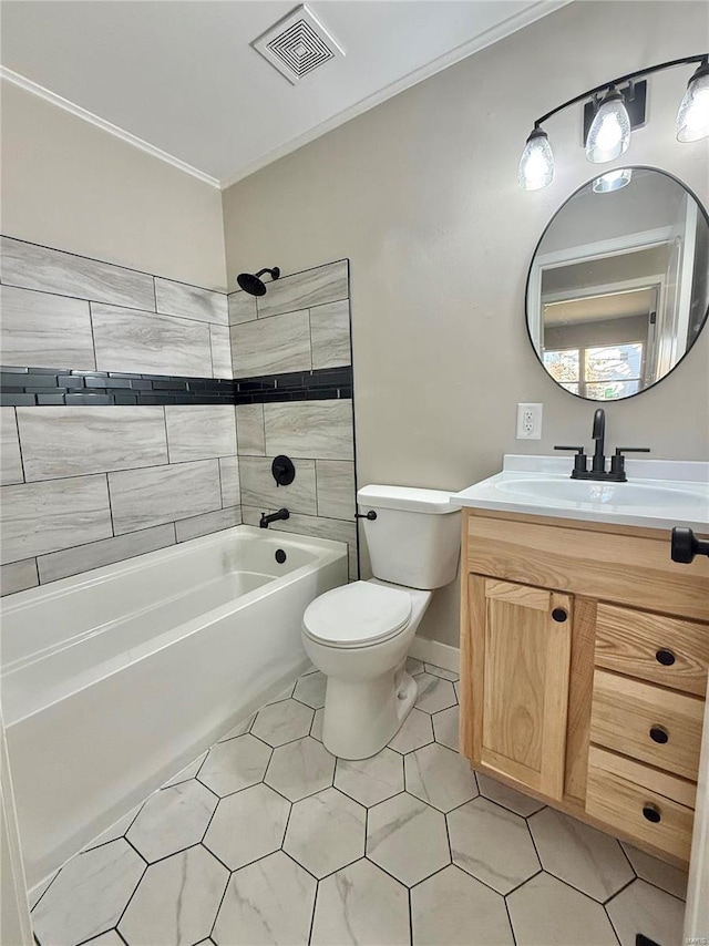 full bathroom with vanity, toilet, tiled shower / bath, and crown molding