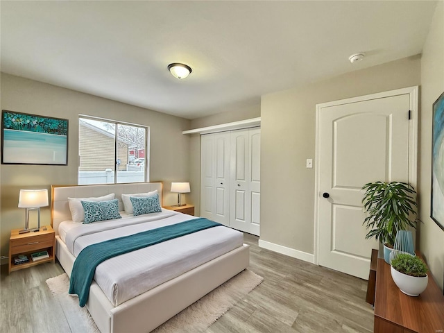 bedroom featuring a closet and light hardwood / wood-style flooring