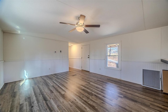 unfurnished room with ceiling fan, dark hardwood / wood-style flooring, and vaulted ceiling