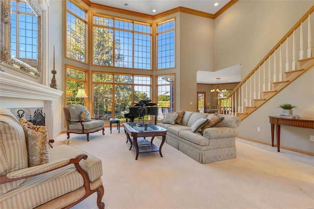 living room with a fireplace, a towering ceiling, light carpet, a chandelier, and crown molding