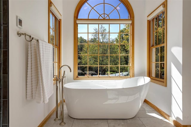 bathroom featuring a tub and tile patterned floors