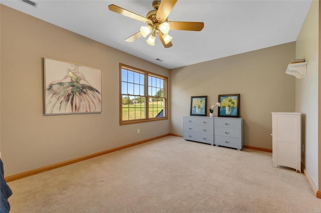 unfurnished bedroom featuring ceiling fan and light colored carpet