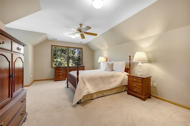 bedroom featuring light carpet, ceiling fan, and vaulted ceiling