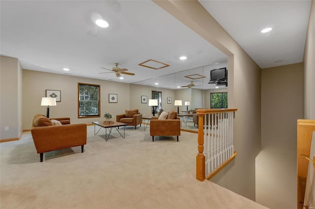 living room featuring ceiling fan and light colored carpet