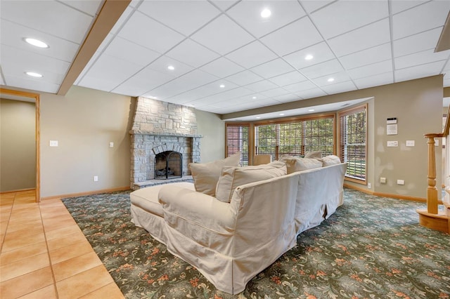 living room featuring tile patterned flooring and a fireplace