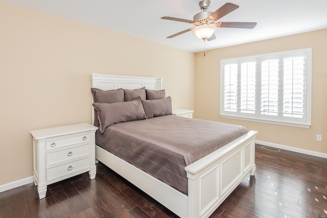 bedroom with ceiling fan and dark wood-type flooring