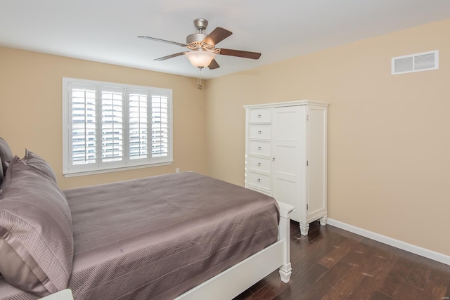 bedroom featuring ceiling fan and dark wood-type flooring