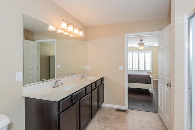 bathroom featuring tile patterned floors, ceiling fan, and vanity