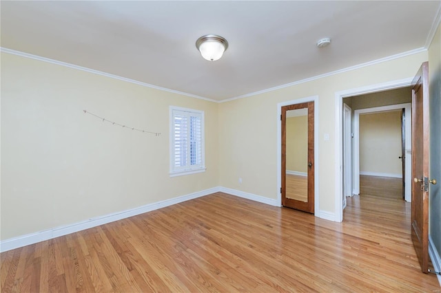 unfurnished bedroom featuring light hardwood / wood-style flooring and ornamental molding