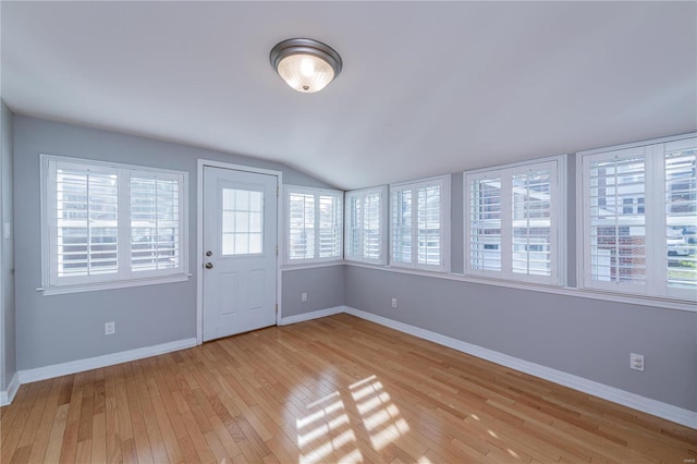 interior space featuring a wealth of natural light and vaulted ceiling