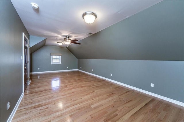 additional living space with ceiling fan, lofted ceiling, and light hardwood / wood-style flooring