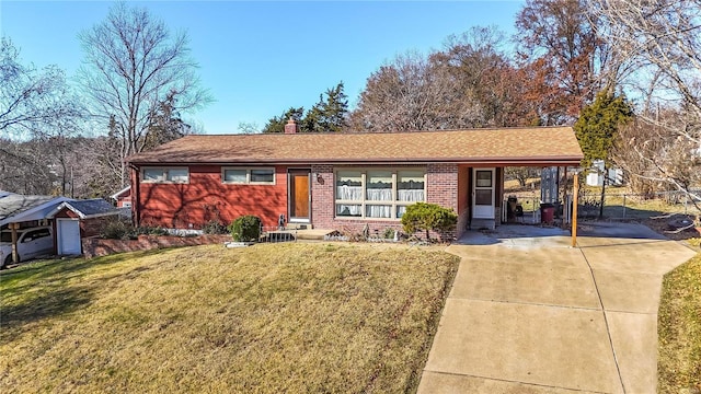 ranch-style house with a front yard and a carport