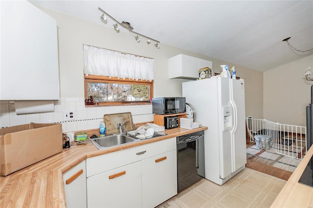 kitchen with decorative backsplash, sink, black appliances, light hardwood / wood-style flooring, and white cabinets