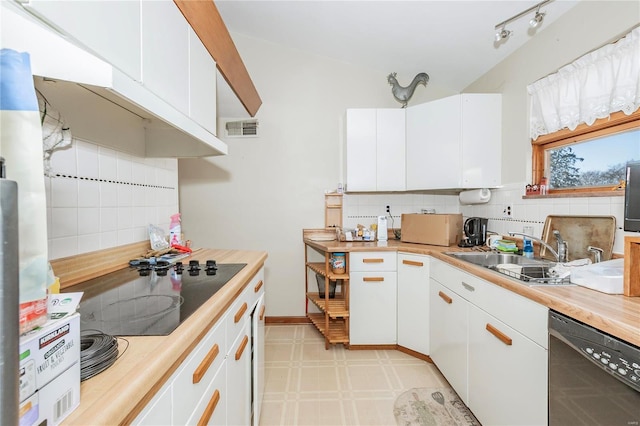 kitchen with backsplash, white cabinets, sink, dishwasher, and black stovetop