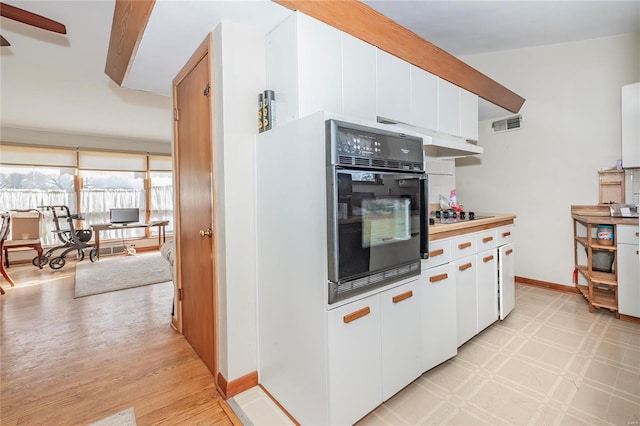 kitchen featuring white cabinets, light hardwood / wood-style floors, and black appliances