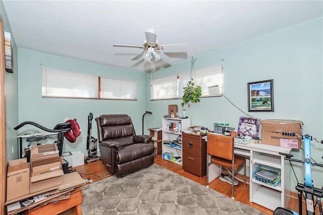 office area with hardwood / wood-style floors and ceiling fan