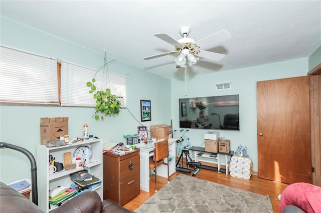 office area featuring light hardwood / wood-style flooring and ceiling fan