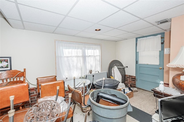 misc room with a paneled ceiling