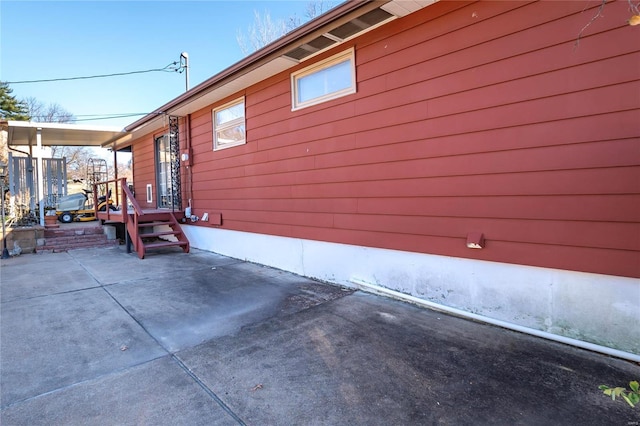 view of property exterior with a patio