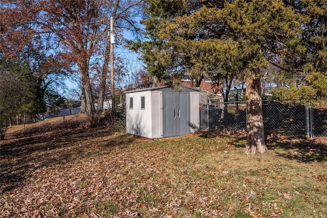 view of outbuilding with a lawn