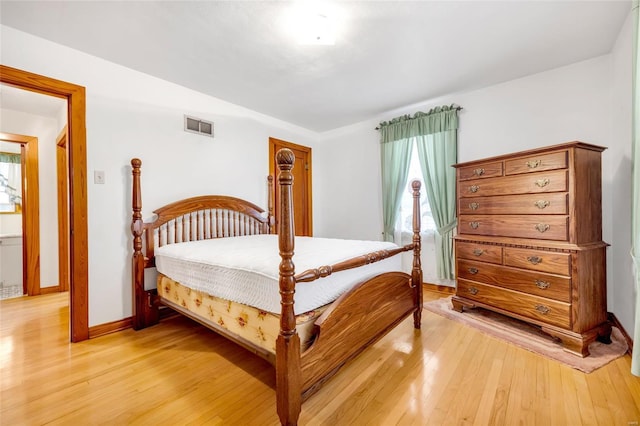 bedroom with light wood-type flooring