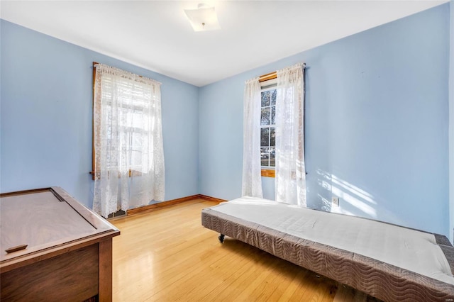 bedroom with light hardwood / wood-style flooring