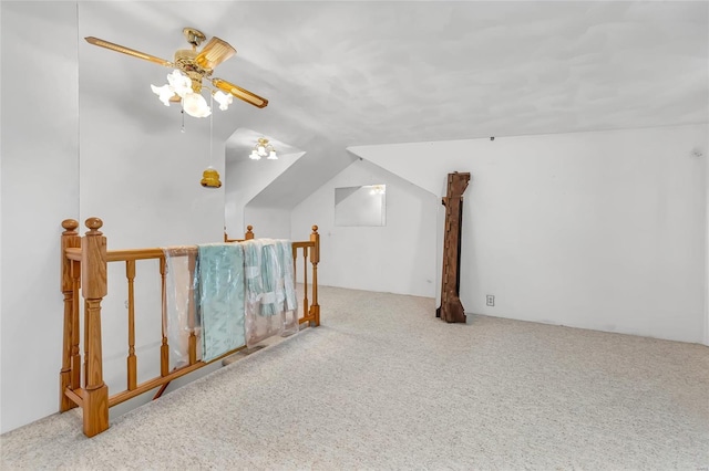 bonus room with light carpet, vaulted ceiling, and ceiling fan