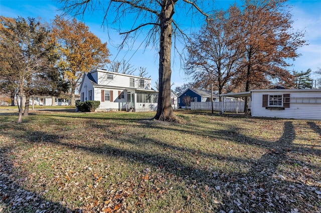 exterior space with a front yard and a carport