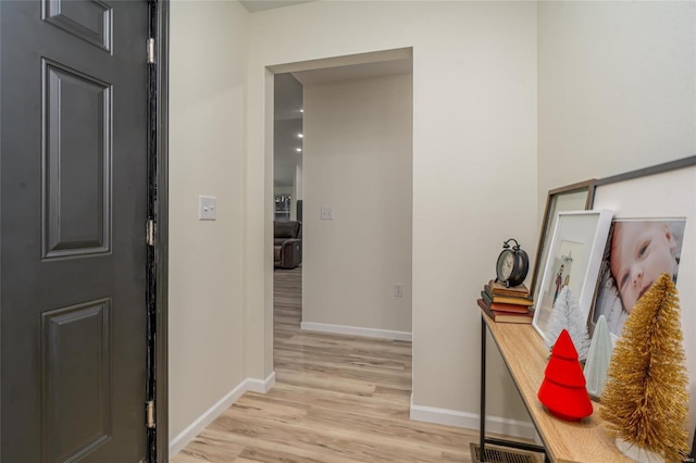 hallway with light wood-type flooring