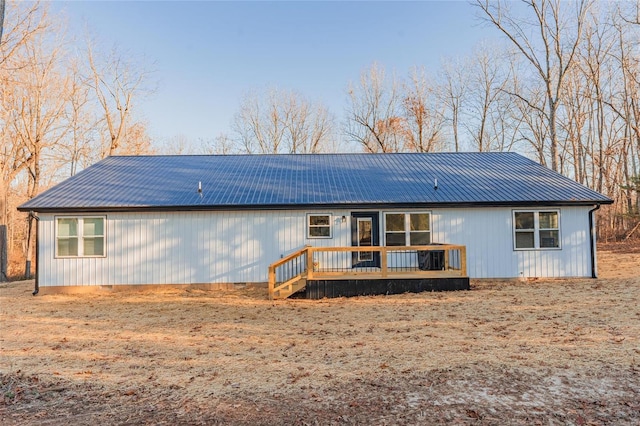 rear view of property with a deck