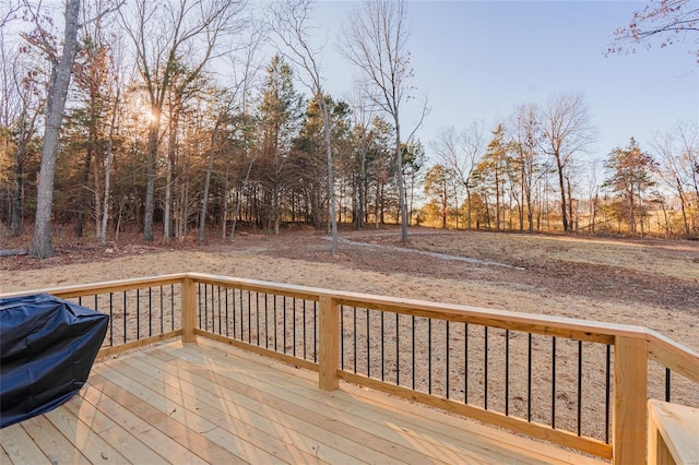 wooden terrace with a grill