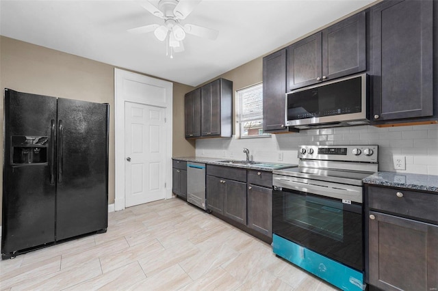 kitchen featuring dark brown cabinets, decorative backsplash, stainless steel appliances, and a sink