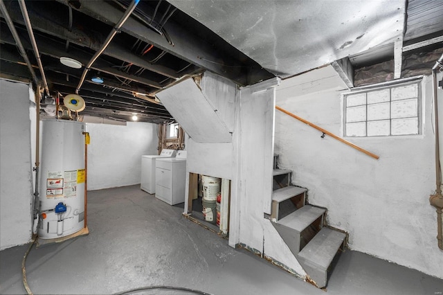 basement featuring stairway, washer and clothes dryer, and gas water heater