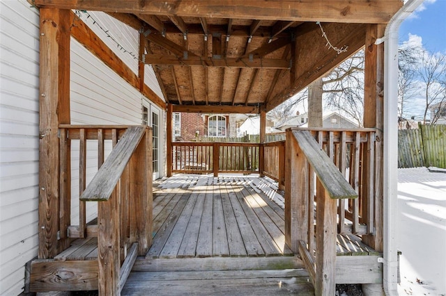 wooden terrace featuring fence