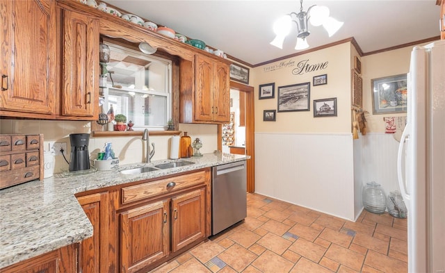 kitchen with light stone countertops, sink, dishwasher, white refrigerator, and a chandelier