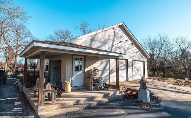 back of property with a garage