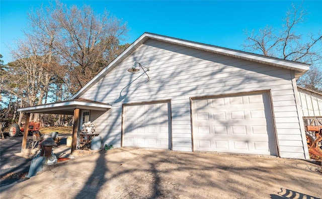 view of side of property with a garage