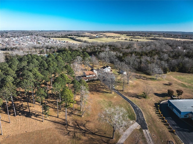 birds eye view of property with a rural view