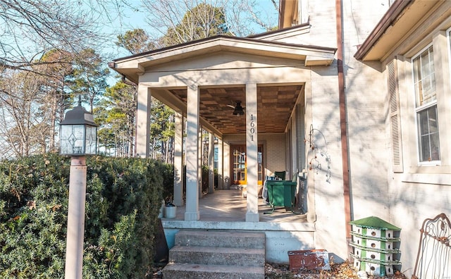 view of exterior entry with covered porch