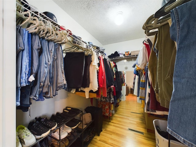 walk in closet featuring hardwood / wood-style floors