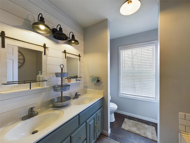 bathroom with tile patterned floors, vanity, and toilet