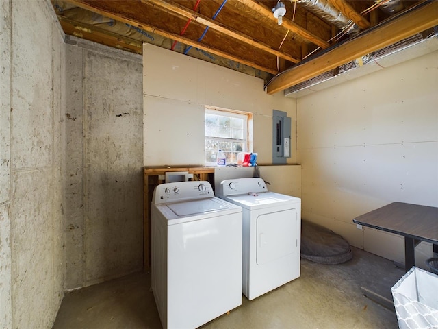 laundry room featuring washer and dryer and electric panel